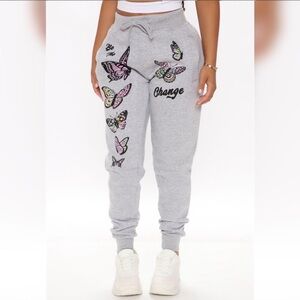 Small grey Fashion Nova sweatpants. Butterfly print.